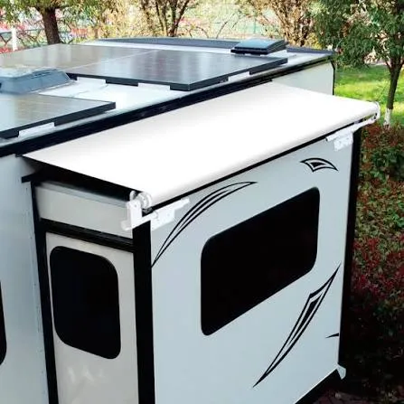 White slide-out topper awning fitted above the slide-out on a travel trailer, keeping debris off the slide roof